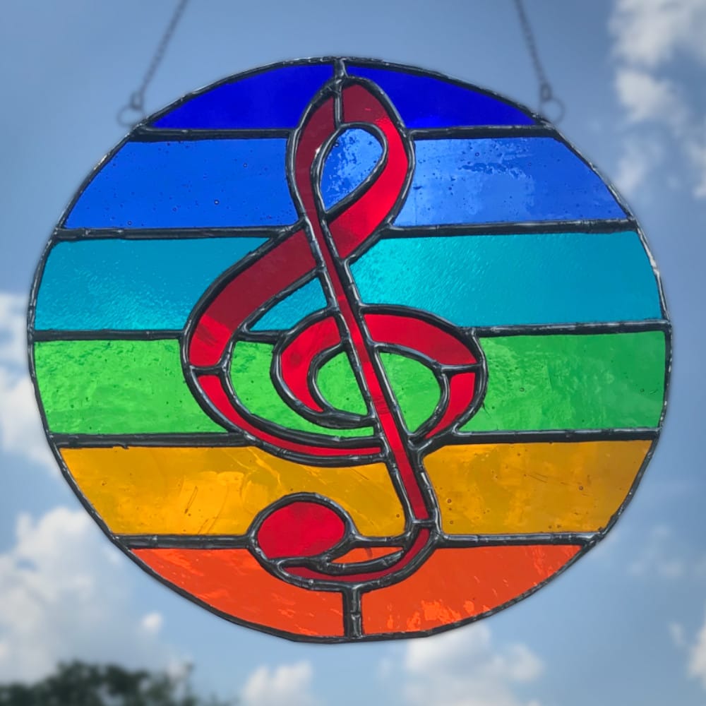 stained glass treble clef in circle