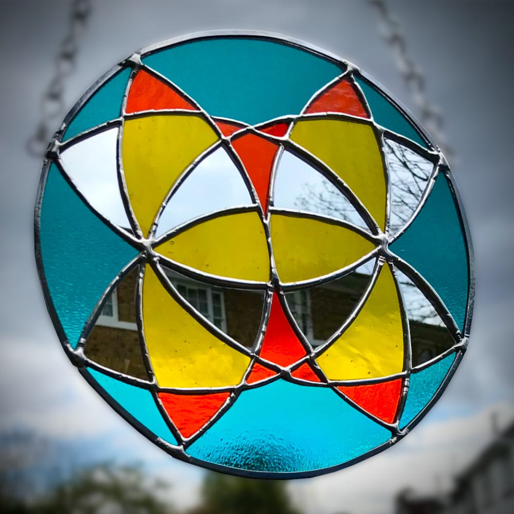 stained glass circle with arcs design