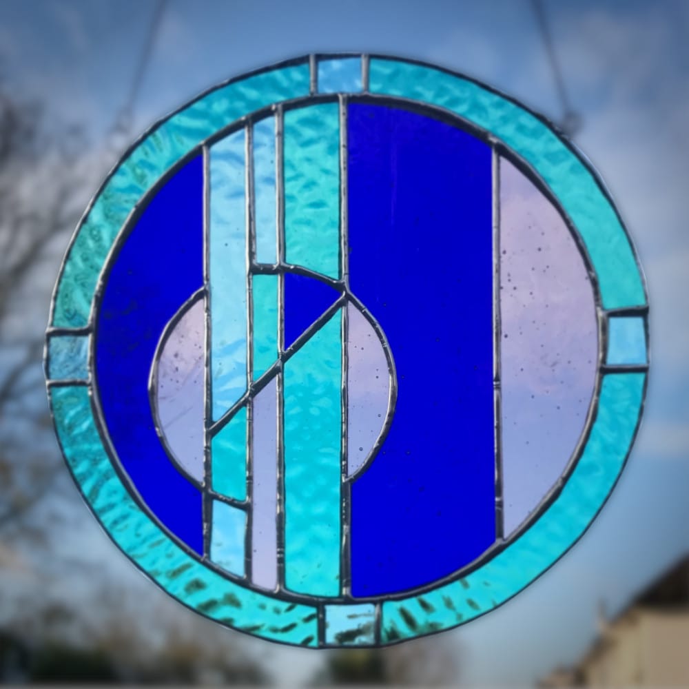 stained glass circle with broken circle design