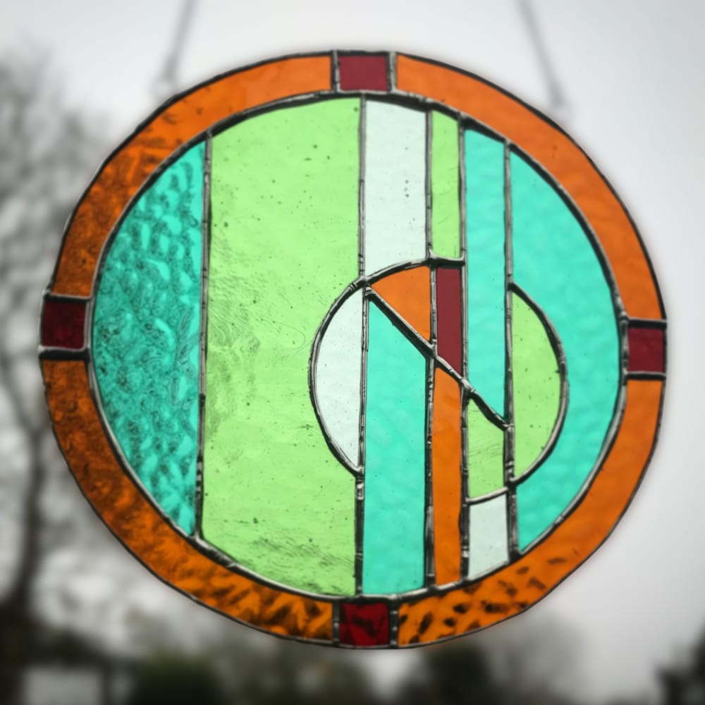 stained glass circle with broken circle design