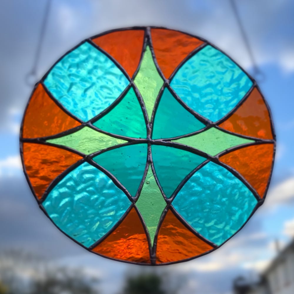 stained glass circle with flower design